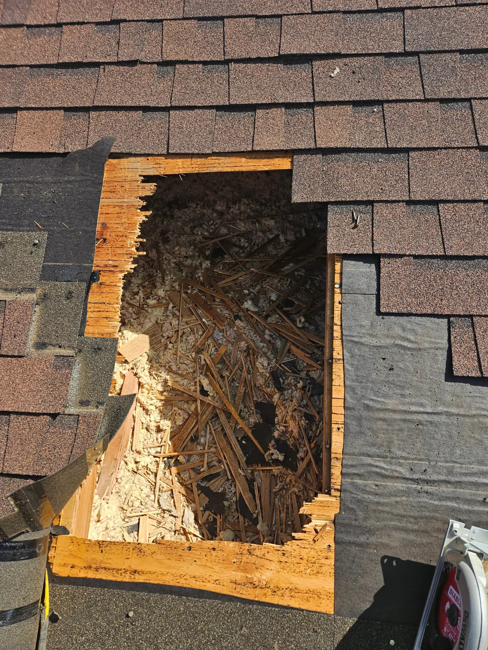 Before: Rotted decking cut out, replaced, and re-shingled